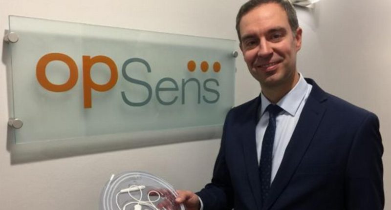 OpSens Inc. - President & CEO, Louis Laflamme, holding the OptoWire.